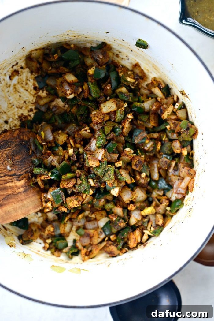 Hearty Poblano Chicken and White Bean Stew 9 Adding minced garlic and dry spices (chili powder, cumin, coriander, oregano) to sautéed vegetables