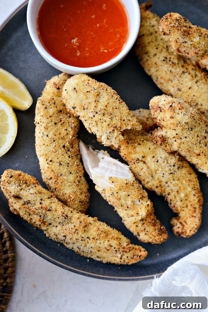 Air Fryer Lemon Pepper Chicken Tenders served with Hot Honey Butter