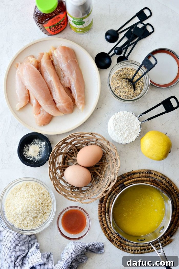 Uncooked chicken tenders ready for breading