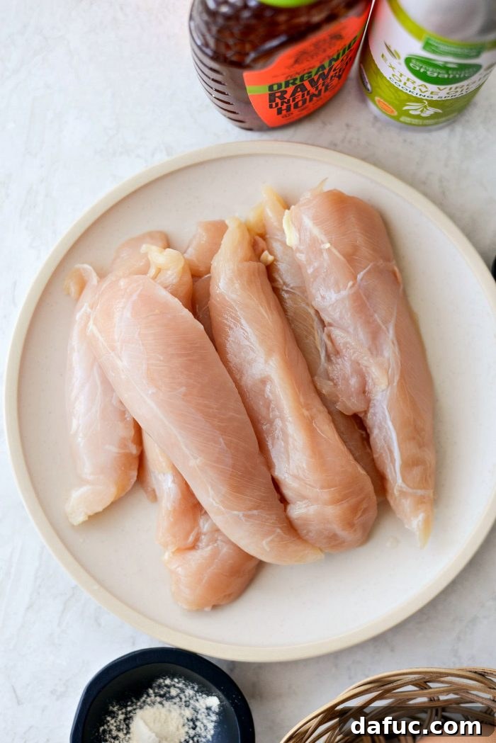 Chicken tenderloins prepared for breading