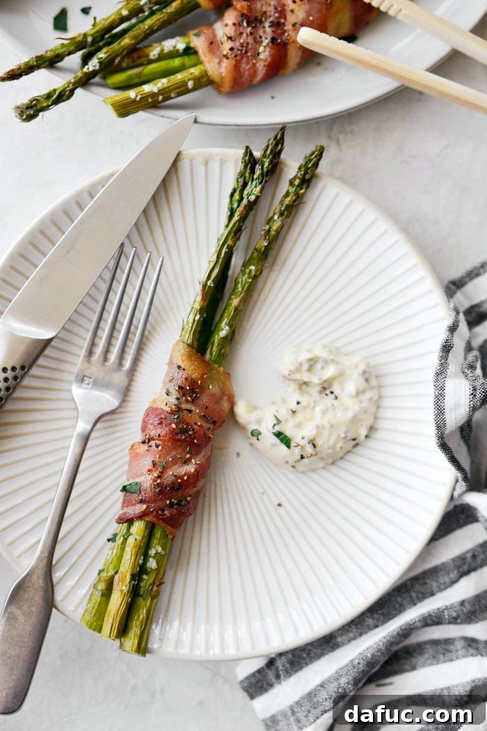 Crispy Bacon Asparagus Treats 14 Close-up of three Bacon Wrapped Asparagus Bundles