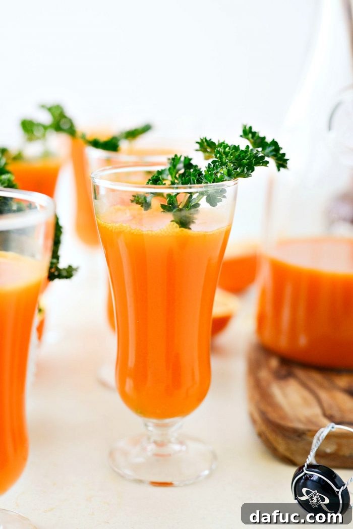 Golden Glow Mimosa 10 The finished Carrot Orange Mimosa, beautifully poured in a flute, showcasing the incredible vibrant orange color and delicate bubbles.