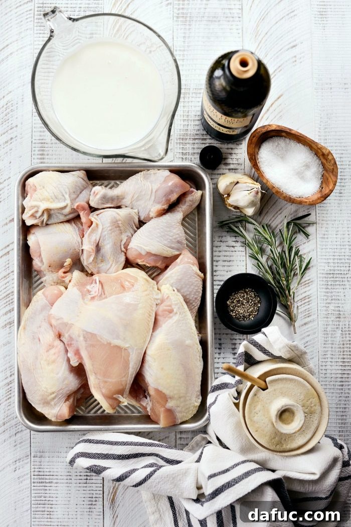 Close-up of chicken pieces marinating in resealable bags with buttermilk, garlic, and rosemary.