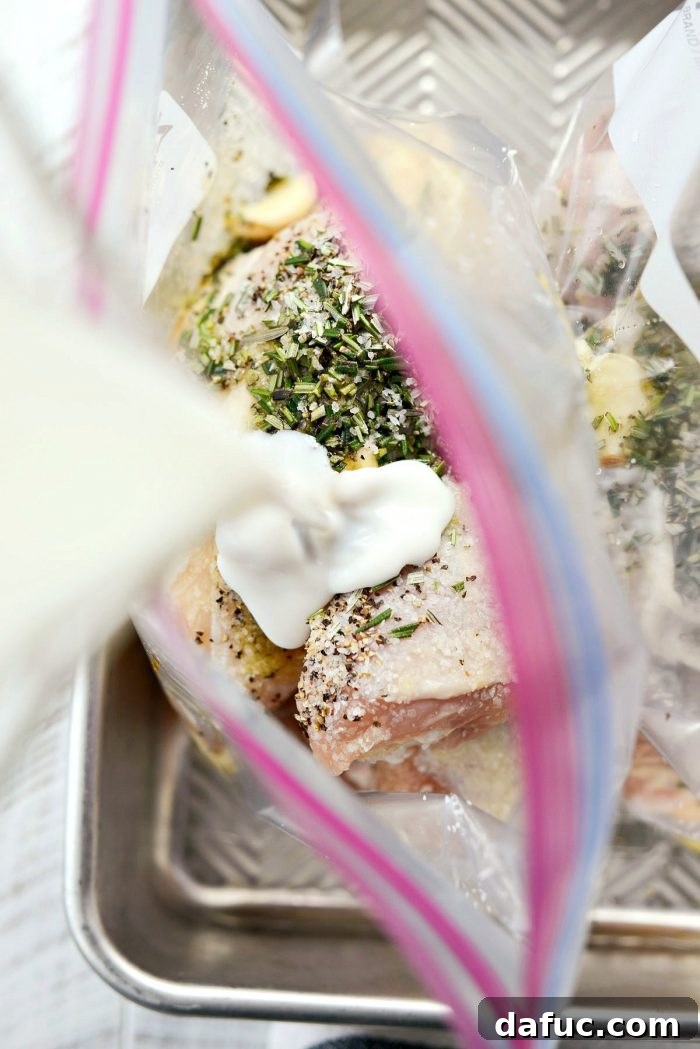 Honey being drizzled into a bag of chicken.