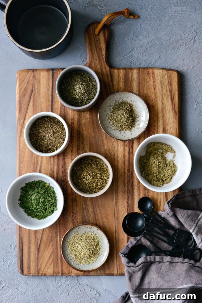 Close-up of dried herbs being measured and mixed in a bowl, showcasing the fresh ingredients for homemade Italian seasoning.