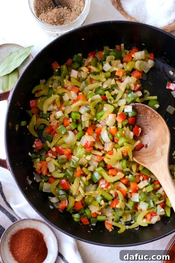 Effortless One Pot Jambalaya 11 Close-up of vegetables softening in the skillet, releasing their aromas | SimplyScratch.com #skillet #shrimp #andouille #rice #creole #chicken #homemade