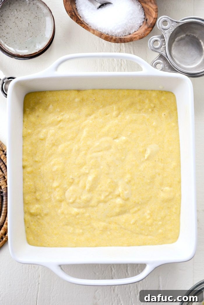 Classic Golden Cornbread 12 Cornbread batter poured into a baking pan.