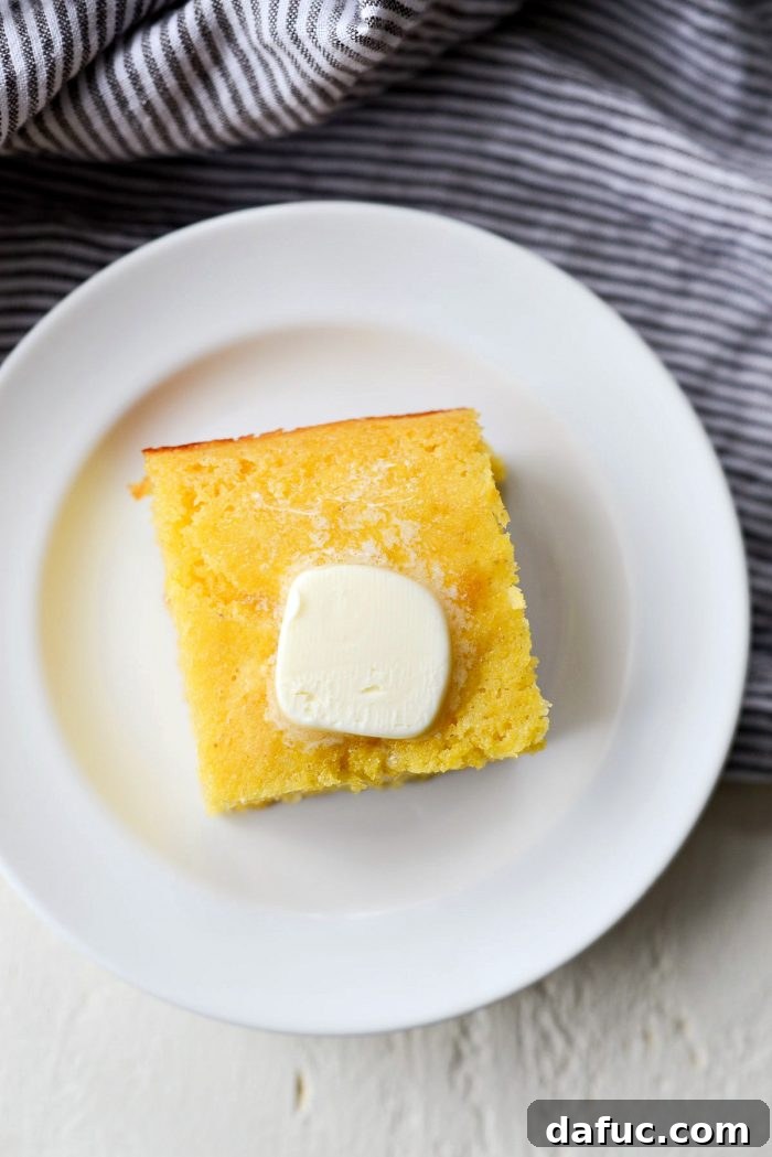 Classic Golden Cornbread 15 Close-up of a delicious piece of homemade cornbread.