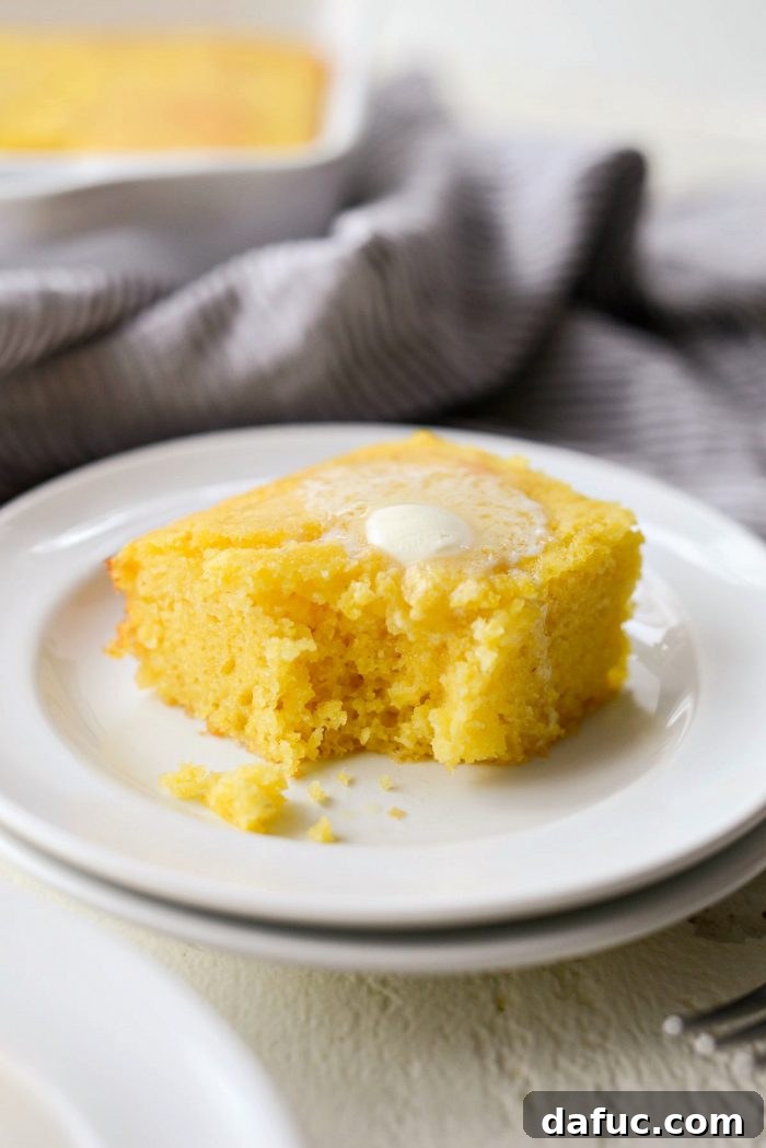 Classic Golden Cornbread 16 Freshly baked cornbread slices ready to be served with butter.
