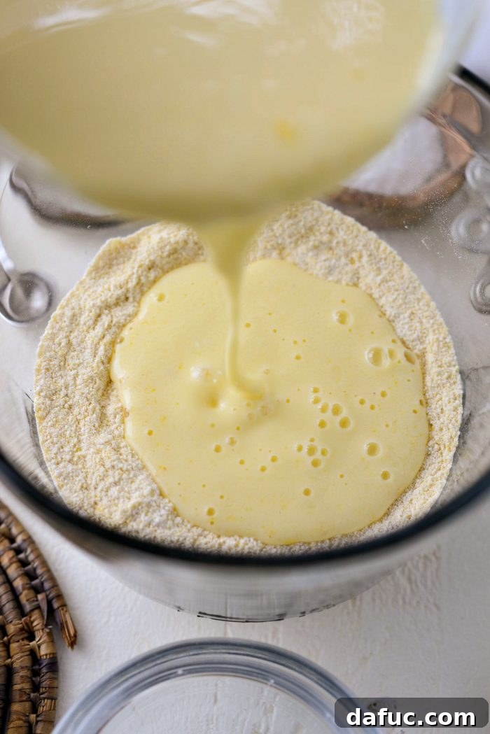 Classic Golden Cornbread 7 Buttermilk and eggs mixed in a bowl.