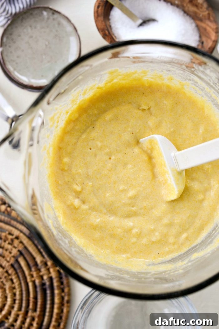Classic Golden Cornbread 10 Melted butter being added to cornbread batter.