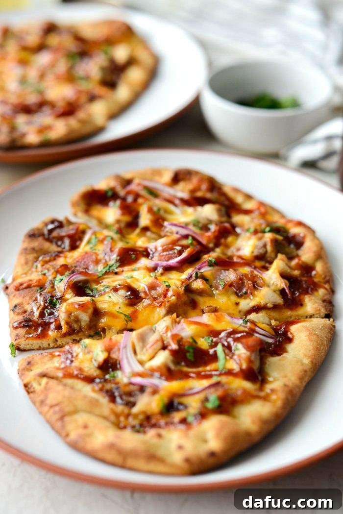 Another enticing shot of a hot BBQ Chicken Naan Pizza, garnished with fresh cilantro.