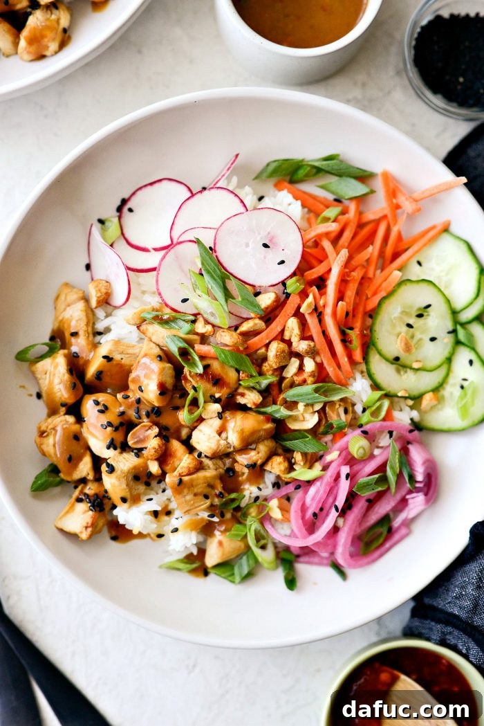 A beautifully assembled Ponzu Chicken Rice Bowl with all toppings