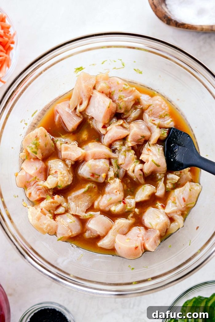 Pieces of chicken marinating in ponzu sauce for 20 minutes