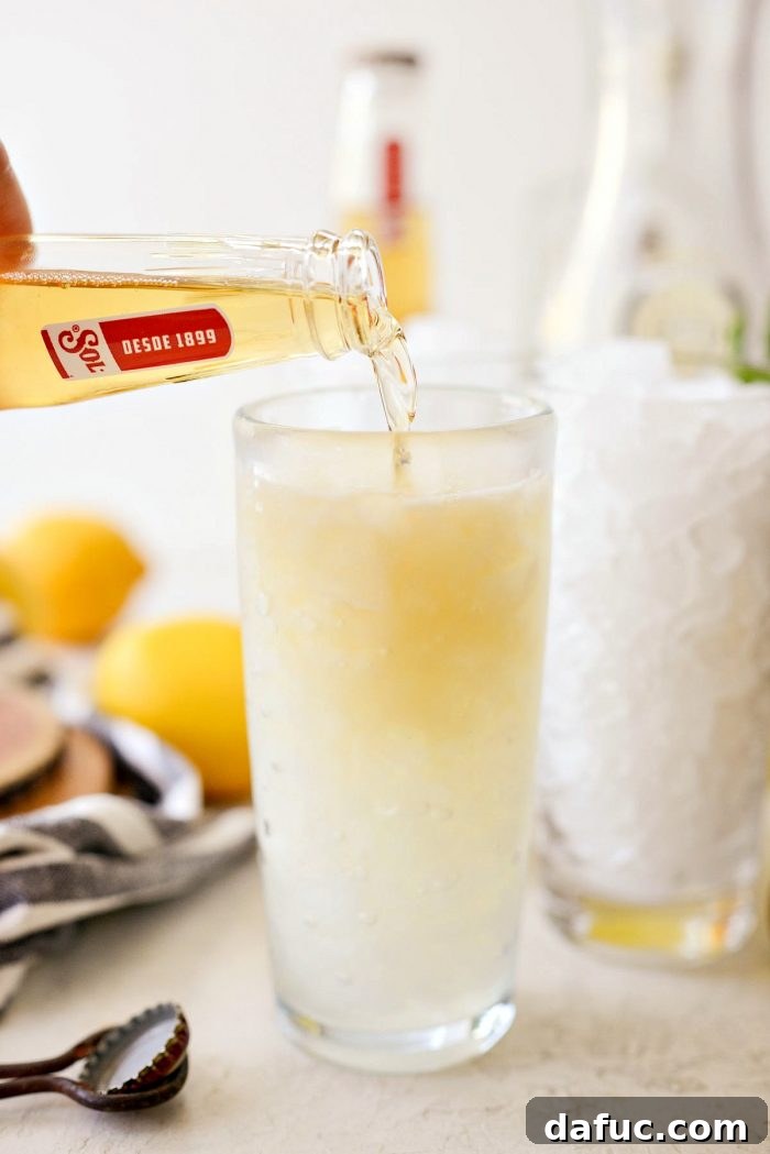 glass topped off with ice cold lager beer