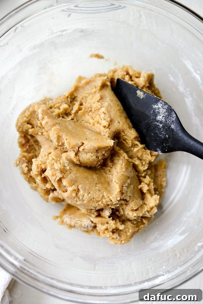 Golden Brown Butter Chocolate Chip Blondies 12 Mixing the blondie batter until the dry ingredients are mostly incorporated.