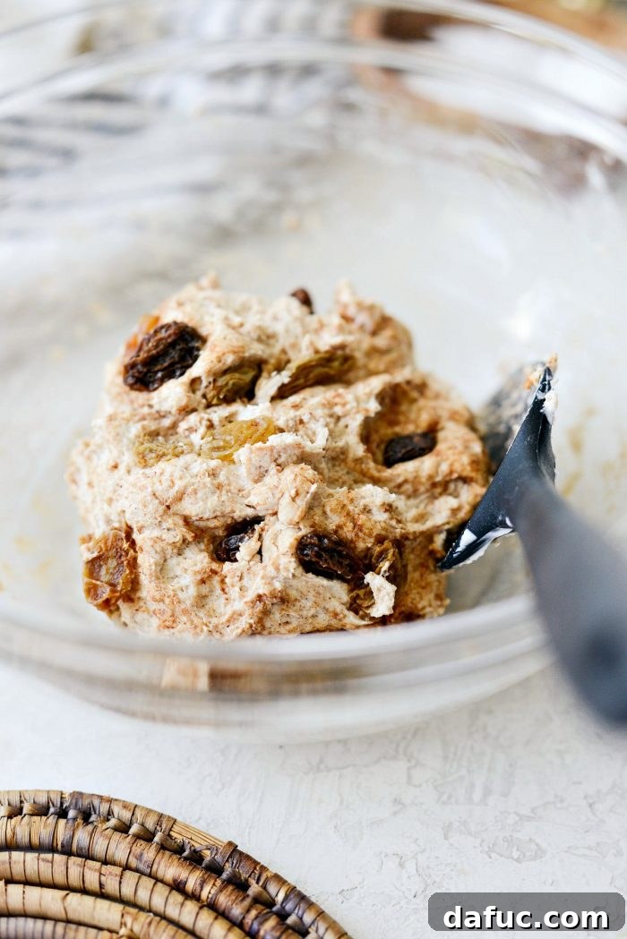 Homemade Air Fryer Cinnamon Raisin Bagels 15 stir raisins into dough.