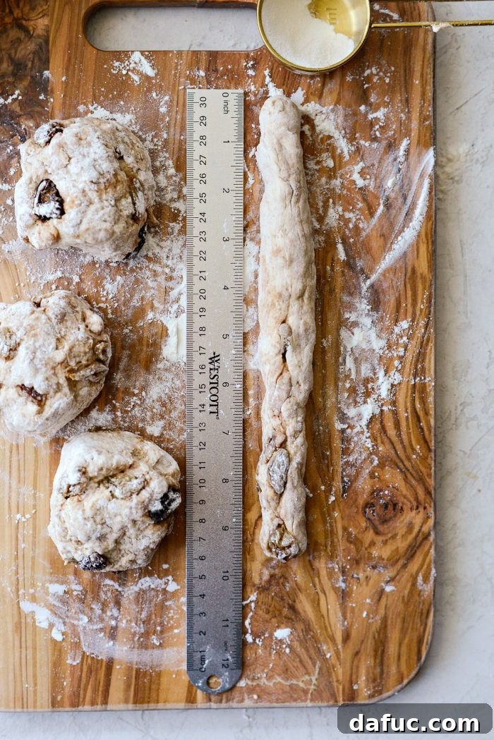 Homemade Air Fryer Cinnamon Raisin Bagels 18 shaped dough into 10 inch rope.