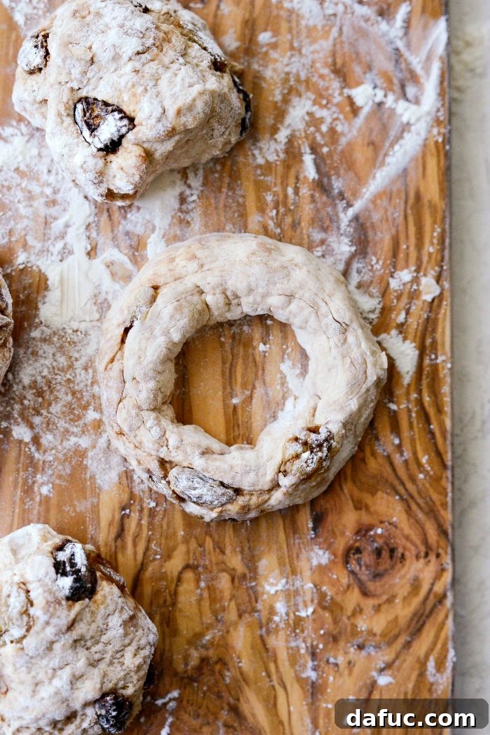 Homemade Air Fryer Cinnamon Raisin Bagels 19 dough shaped into a bagel.
