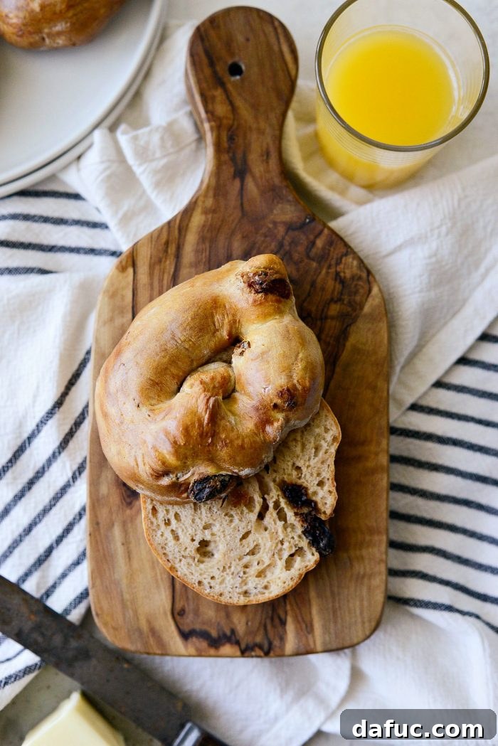 Homemade Air Fryer Cinnamon Raisin Bagels 26 cinnamon raisin bagel sliced in half.