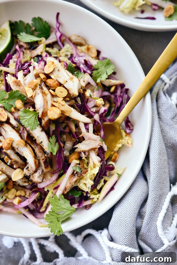 Vibrant Grilled Thai Chicken Salad 20 Extreme close-up of a fork lifting a bite of Grilled Thai Chicken Salad, showing texture and detail.