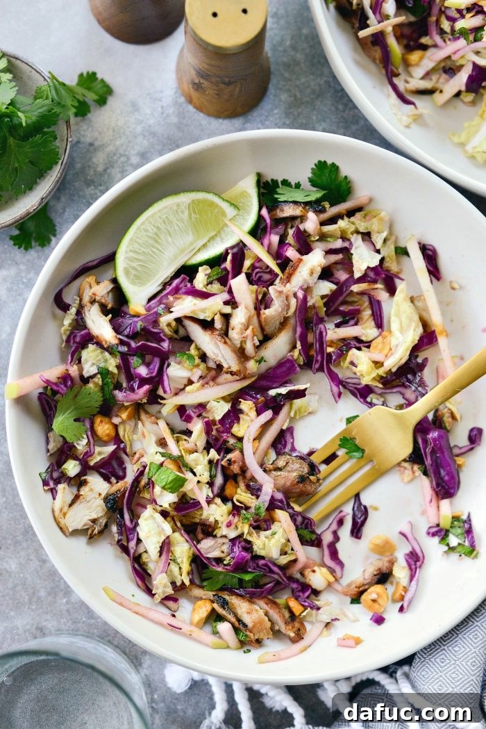 Vibrant Grilled Thai Chicken Salad 22 Partially eaten bowl of Grilled Thai Chicken Salad, showcasing the delicious blend of ingredients.