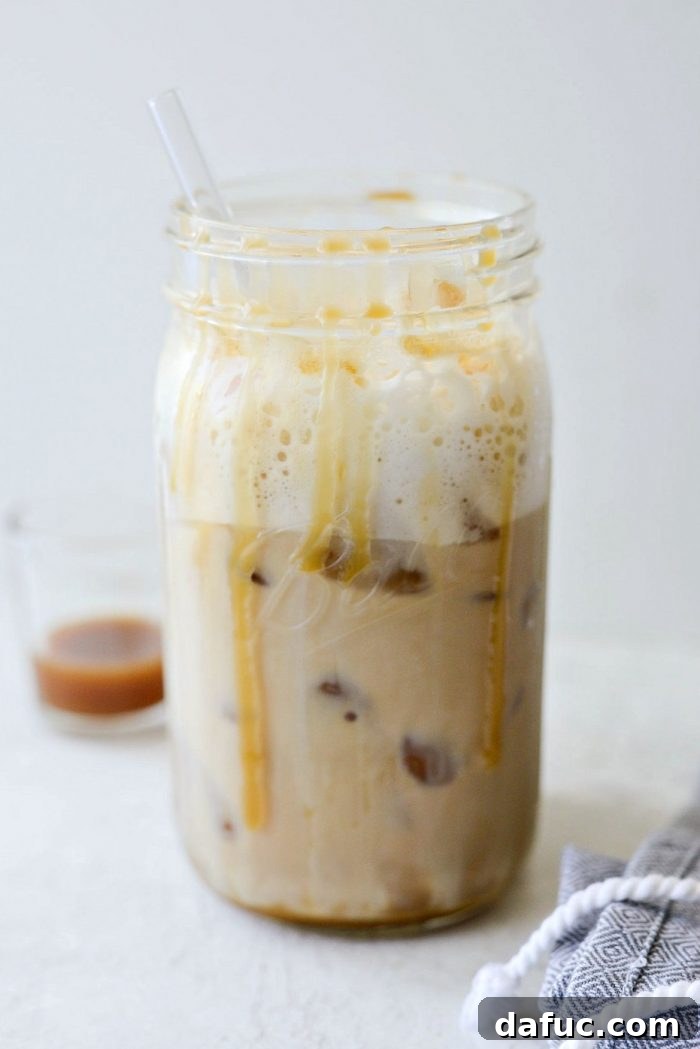 Velvet Caramel Vanilla Chill 17 An ice-cold Iced Caramel Vanilla Latte in a glass jar, condensation visible.