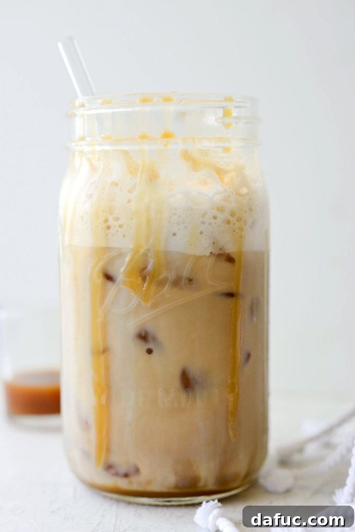 Velvet Caramel Vanilla Chill 18 Beautifully presented Iced Caramel Vanilla Latte in a glass jar.