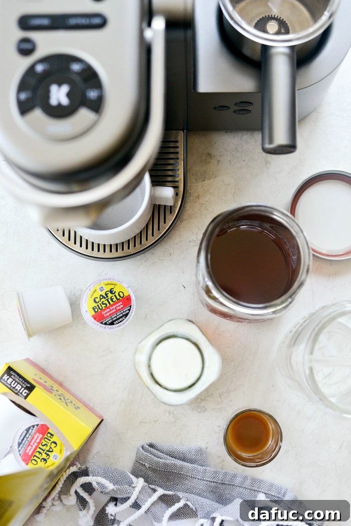 Velvet Caramel Vanilla Chill 3 Ingredients for Iced Caramel Vanilla Latte laid out with a Keurig coffee maker.