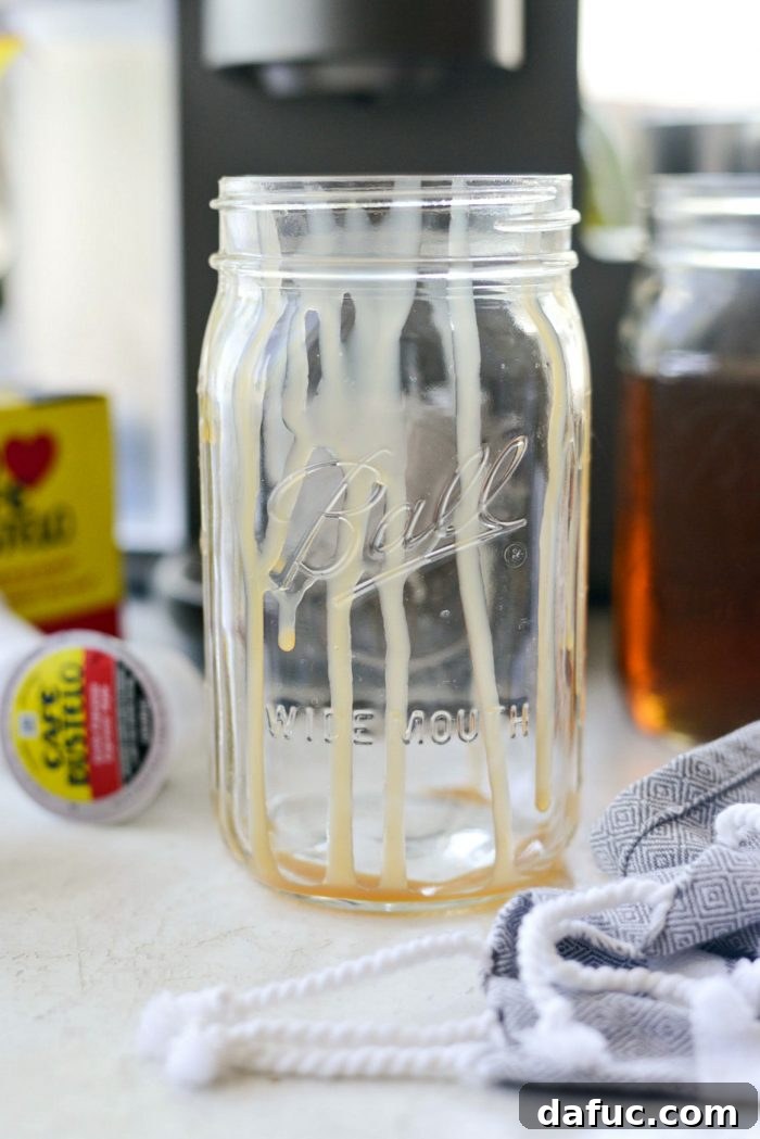 Velvet Caramel Vanilla Chill 4 Glass jar with caramel drizzle inside, ready for latte ingredients.