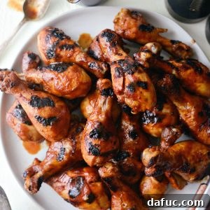 Easy BBQ Chicken Drumsticks on round platter.