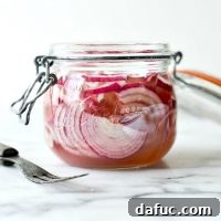 Zesty Quick Pickled Red Onions 14 A jar of quick pickled red onions, perfect for a tangy topping