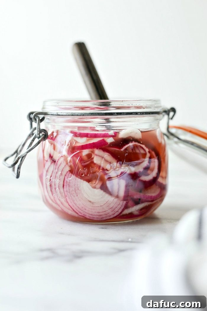 Zesty Quick Pickled Red Onions 3 Glass jar with a tight-fitting lid containing quick pickled red onions
