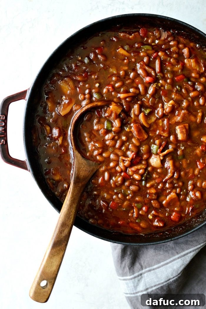 One Pot Wonder Baked Beans 16 the vibrant red pot of one pot wicked baked beans, perfectly cooked and ready to be served