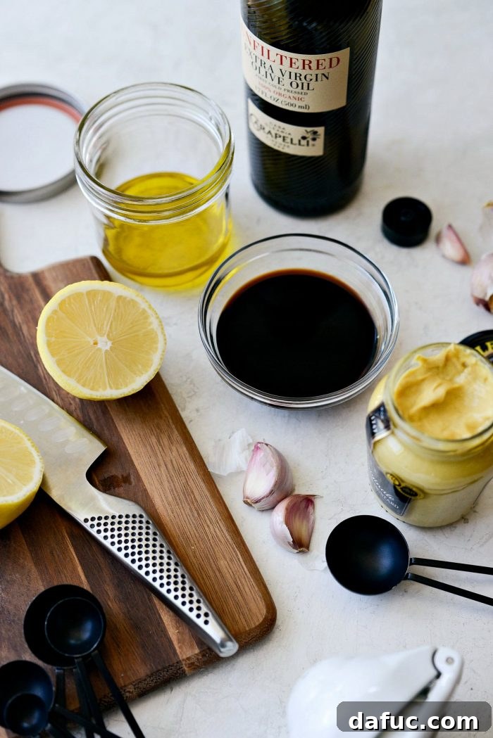 Ingredients for the balsamic dijon dressing in a jar.