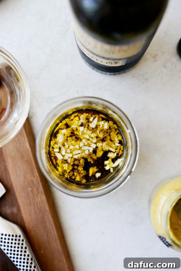 All dressing ingredients added to a jar.