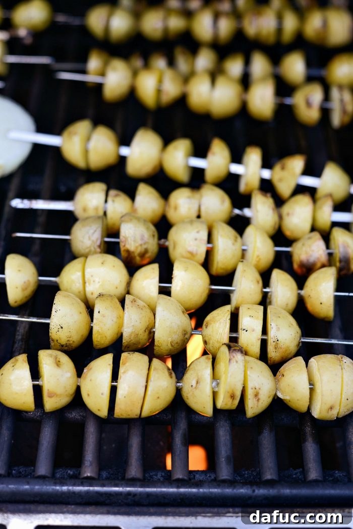 Potatoes grilling on a preheated grill.