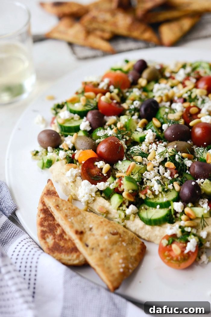 Close-up of the delicious layers of loaded hummus dip