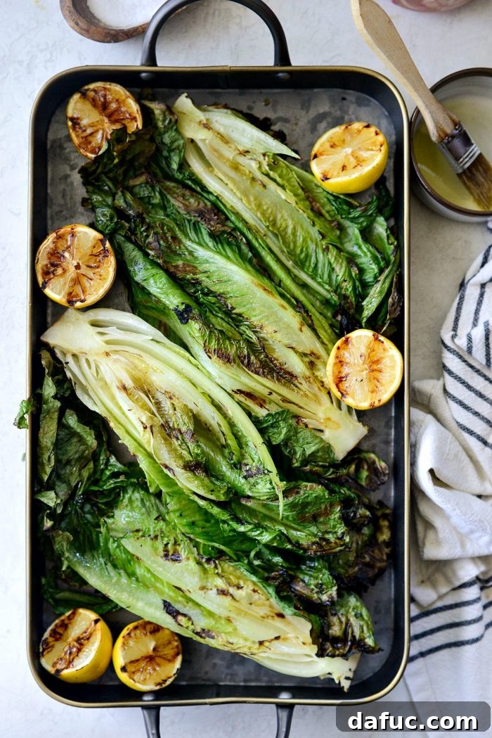 Platter with grilled romaine lettuce, topped with initial bacon and parmesan cheese