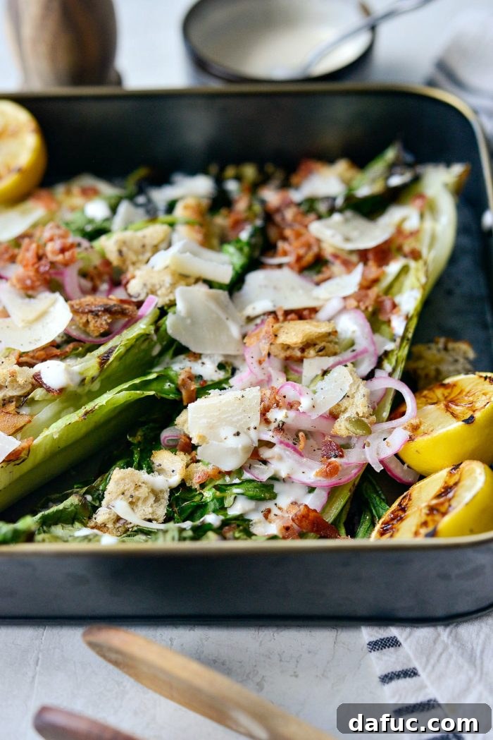 An overhead shot of Grilled Romaine Salad with all the delicious toppings, ready to be served