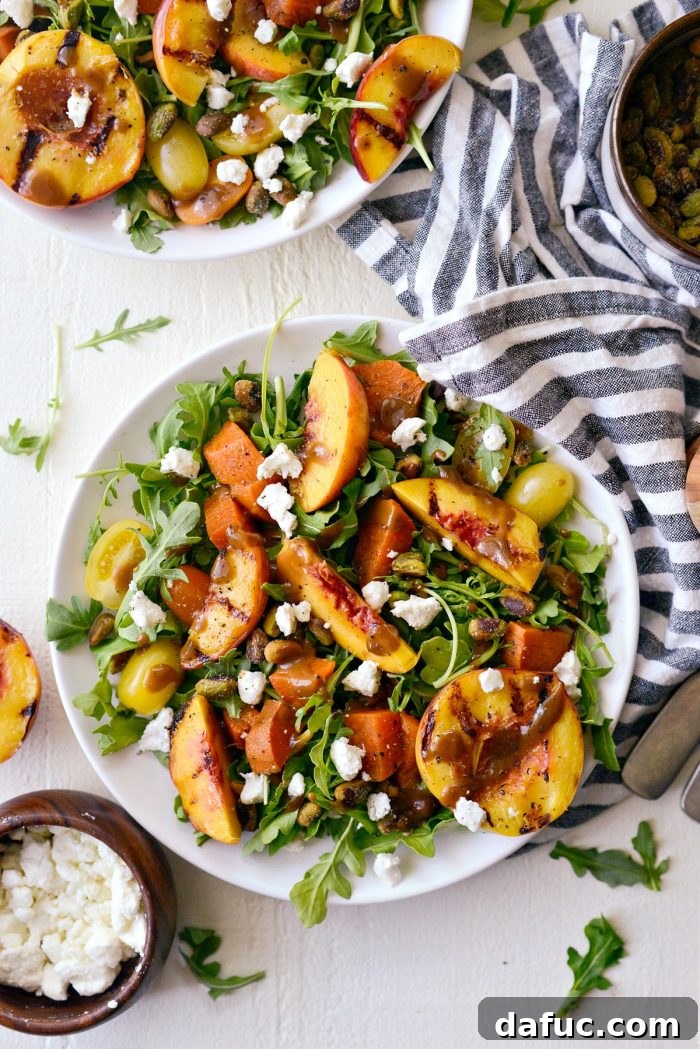 A vibrant Grilled Peach and Sweet Potato Arugula Salad with fresh ingredients
