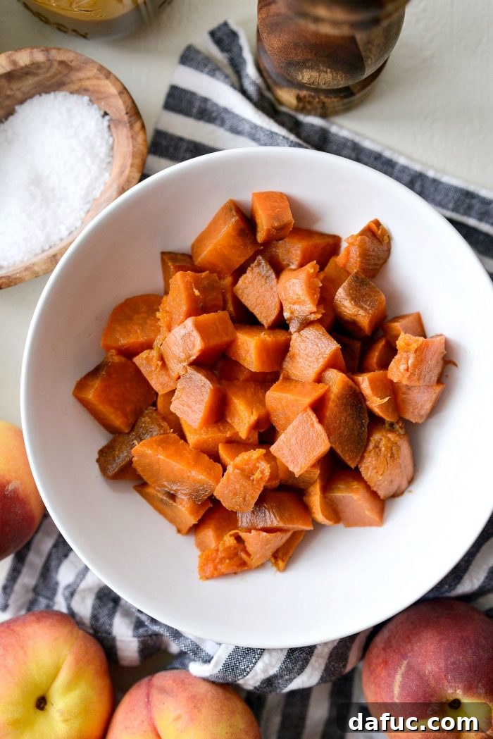 Sweet and Savory Peach Sweet Potato Arugula Salad 5 Roasted sweet potatoes in a bowl, diced into cubes