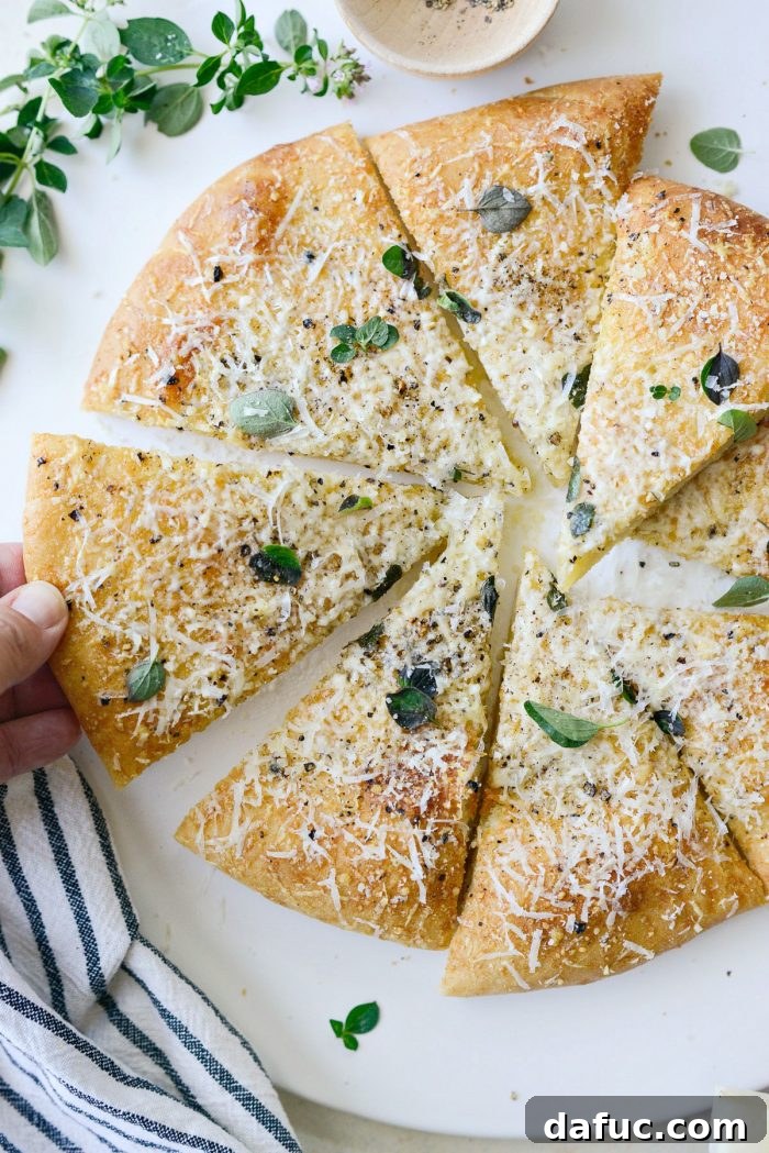 Roman Cheese and Pepper Pizza 17 Cacio e Pepe pizza slices on a cutting board, ready to be enjoyed