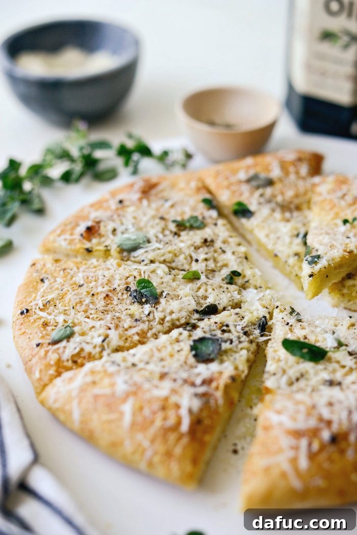 Roman Cheese and Pepper Pizza 3 Two Cacio e Pepe pizzas cooking on a hot pizza stone in the oven