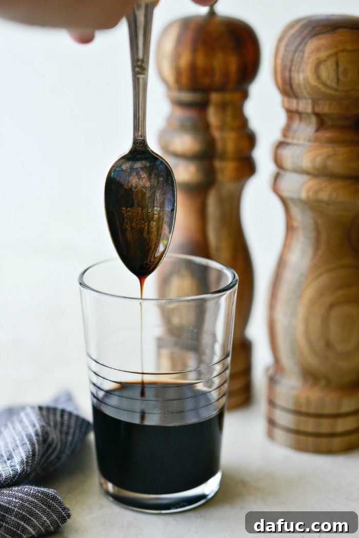 A small glass bottle containing homemade balsamic glaze