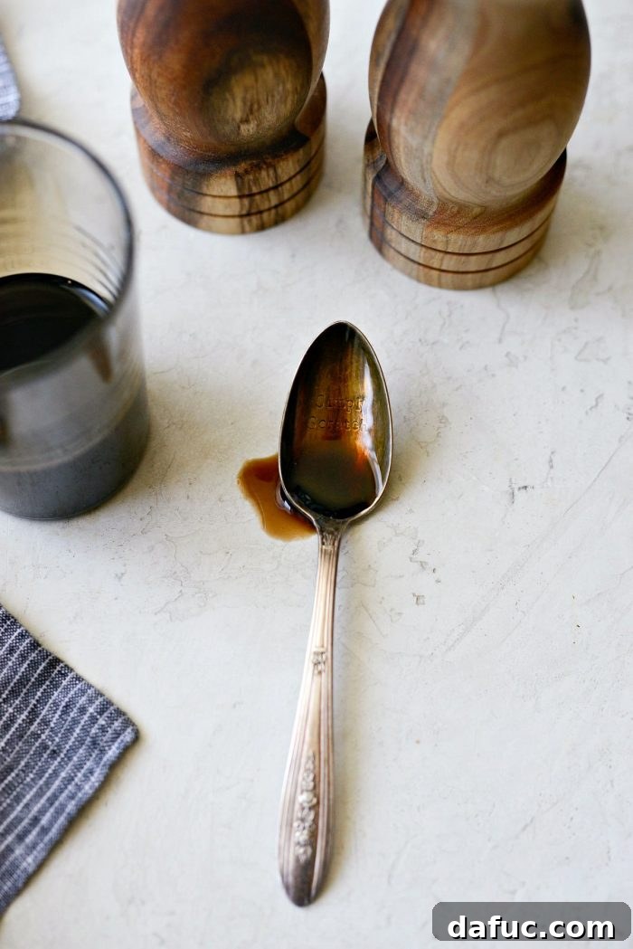 Close-up of thick homemade balsamic glaze on a spoon