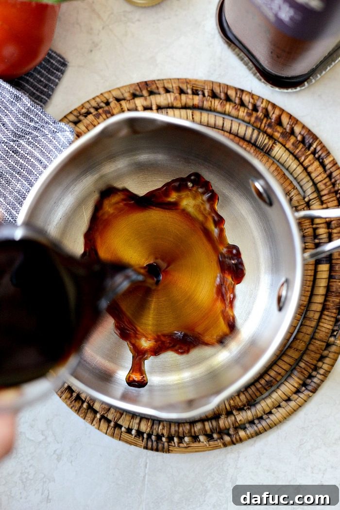 Pouring balsamic vinegar into a saucepan