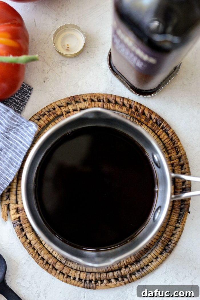 Balsamic vinegar simmering in a saucepan