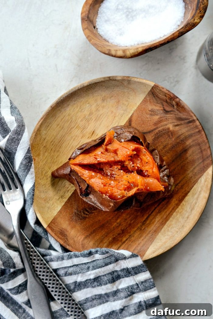 Caramelized Whole Sweet Potatoes 2 Whole Roasted Sweet Potatoes on a baking sheet, golden and tender