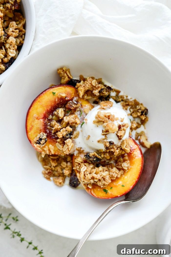 Baked Nectarines with Oatmeal Cookie Crumble in bowl with ice cream